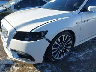 2017 Lincoln Continental Reserve with VIN 1LN6L9RP4H5609432, listed as a IAAI auction lot 41274549 with 104,742 mi miles. Bid and sale history available at carsss.com. Image 6.
