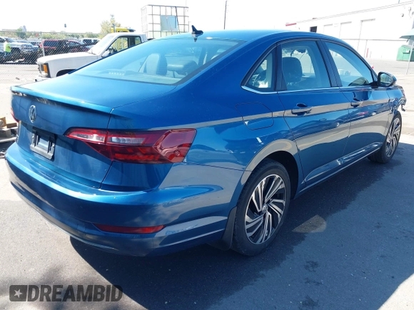 2021 Volkswagen Jetta SEL with VIN 3VWE57BUXMM050386, listed as a IAAI auction lot 42140492 with 74,477 mi miles and . Bid and sale history available at DreamBid. Image 4.