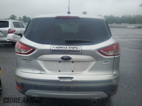 2013 Ford Escape SE with VIN 1FMCU9GX7DUB16914, listed as a Copart auction lot 61168145 with 135,291 mi miles and Clean title. Bid and sale history available at DreamBid. Image 6.