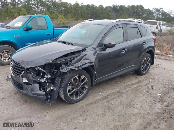 2016 Mazda CX-5 Grand Touring with VIN JM3KE4DY8G0796290, listed as a IAAI auction lot 41619977 with NaN miles. Bid and sale history available at carsss.com. Image 2.