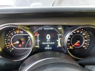 2021 Jeep Gladiator 80th Anniversary with VIN 1C6HJTAG7ML619025, listed as a Copart auction lot 63309365 with 69,126 mi miles and Salvage title. Bid and sale history available at DreamBid. Image 9.