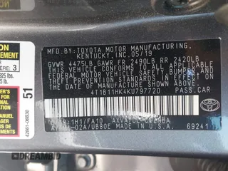 2019 Toyota Camry LE z VIN 4T1B11HK4KU797720, wystawiony jako IAAI lot #42053830 z przebiegiem 102 558 mil mil oraz . Historia ofert i sprzedaży dostępna na DreamBid. Obrazek 9.
