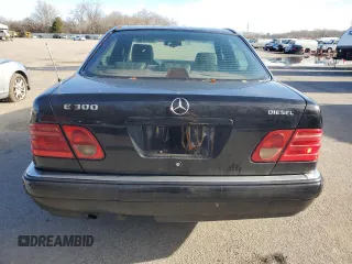 1996 Mercedes-Benz E Class with VIN WDBJF20F9TJ023003, listed as a Copart auction lot 86356784 with 230,944 mi miles and Salvage Title. Bid and sale history available at carsss.com. Image 6.