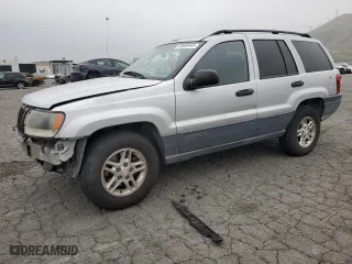 2004 Jeep Grand Cherokee Laredo with VIN 1J4GX48S64C151124, listed as a Copart auction lot 52669445 with 152,970 mi miles and Salvage Title. Bid and sale history available at carsss.com. Image 1.