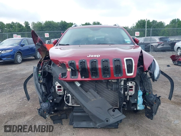 2015 Jeep Cherokee Latitude z VIN 1C4PJMCS0FW534959, wystawiony jako IAAI lot #42657381 z przebiegiem 114 577 mil mil oraz . Historia ofert i sprzedaży dostępna na DreamBid. Obrazek 6.