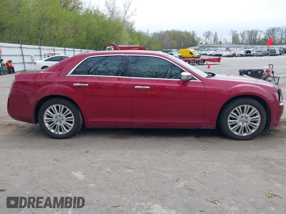 2012 Chrysler 300 C with VIN 2C3CCAKTXCH220185, listed as a IAAI auction lot 42110327 with 57,682 mi miles and . Bid and sale history available at DreamBid. Image 13.