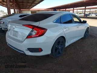 2020 Honda Civic LX with VIN 19XFC2F66LE007328, listed as a IAAI auction lot 41852111 with 135,956 mi miles and . Bid and sale history available at DreamBid. Image 4.