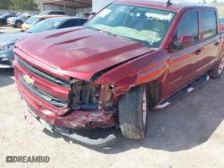 2016 Chevrolet Silverado 1500 LT with VIN 3GCUKREC0GG354271, listed as a IAAI auction lot 38948207 with 130,369 mi miles. Bid and sale history available at carsss.com. Image 6.