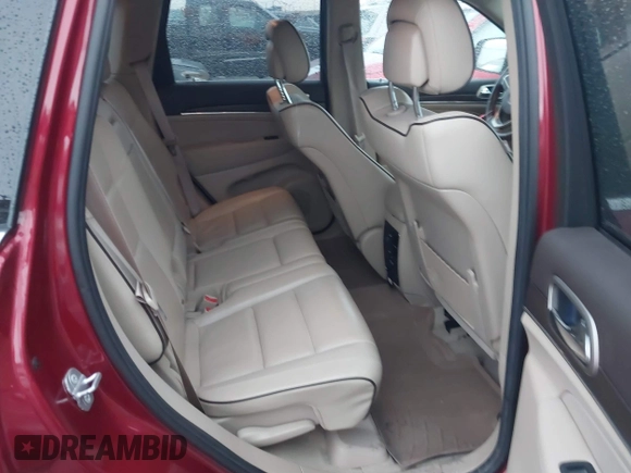 2014 Jeep Grand Cherokee Overland with VIN 1C4RJFCG9EC299235, listed as a IAAI auction lot 41670065 with 108,589 mi miles and . Bid and sale history available at DreamBid. Image 8.
