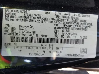 2015 Ford Focus SE with VIN 1FADP3F29FL210973, listed as a IAAI auction lot 41874367 with 128,705 mi miles. Bid and sale history available at carsss.com. Image 9.