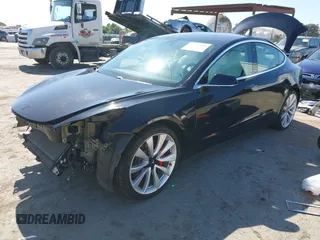 2019 Tesla Model 3 Long Range with VIN 5YJ3E1EB9KF231742, listed as a IAAI auction lot 42114608 with 86,657 mi miles and . Bid and sale history available at DreamBid. Image 2.