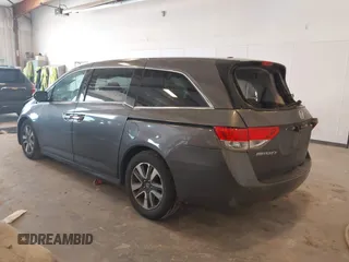 2014 Honda Odyssey Touring with VIN 5FNRL5H99EB105059, listed as a IAAI auction lot 42457672 with 240,581 mi miles and . Bid and sale history available at DreamBid. Image 3.