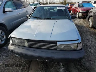 1990 Toyota Camry DLX z VIN 4T1SV21E8LU165609, wystawiony jako Copart lot #79314534 z przebiegiem 153 006 mil mil oraz Szkoda całkowita • Salvage title. Historia ofert i sprzedaży dostępna na DreamBid. Obrazek 5.