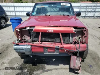 1999 Jeep Cherokee Sport z VIN 1J4FF68S7XL590900, wystawiony jako Copart lot #55098635 z przebiegiem 265 588 mil mil oraz Szkoda całkowita • Salvage title. Historia ofert i sprzedaży dostępna na DreamBid. Obrazek 5.