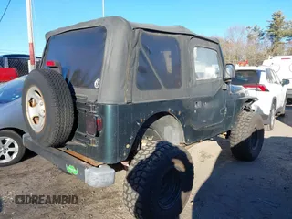 2005 Jeep Wrangler SE with VIN 1J4FA29155P366432, listed as a IAAI auction lot 41260303 with 134,021 mi miles. Bid and sale history available at carsss.com. Image 4.