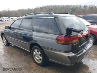 1997 Subaru Legacy Wagon Outback with VIN 4S3BG6854V7613017, listed as a IAAI auction lot 41574832 with 294,964 mi miles. Bid and sale history available at carsss.com. Image 3.