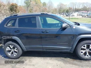 2014 Jeep Cherokee Trailhawk with VIN 1C4PJMBB6EW162303, listed as a IAAI auction lot 41910167 with 133,669 mi miles. Bid and sale history available at carsss.com. Image 14.