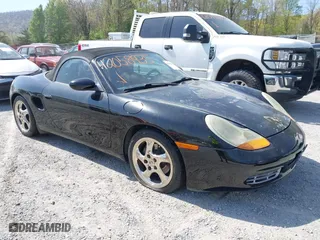 1999 Porsche Boxster with VIN WP0CA2980XU624284, listed as a IAAI auction lot 42058935 with 79,497 mi miles. Bid and sale history available at carsss.com. Image 6.