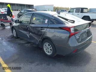 2021 Toyota Prius L Eco with VIN JTDKAMFU4M3134778, listed as a IAAI auction lot 41843429 with 145,757 mi miles. Bid and sale history available at carsss.com. Image 3.