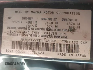 2014 Mazda 3 i Grand Touring with VIN JM1BM1W7XE1142039, listed as a IAAI auction lot 41688696 with 198,564 mi miles and . Bid and sale history available at carsss.com. Image 9.