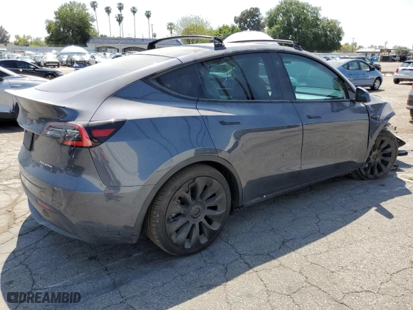 2021 Tesla Model Y Long Range with VIN 5YJYGDEEXMF070154, listed as a Copart auction lot 50742325 with 23,376 mi miles and Salvage Title. Bid and sale history available at carsss.com. Image 3.