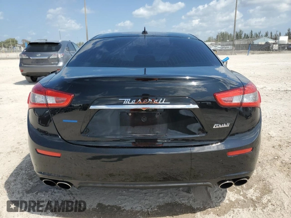 2016 Maserati Ghibli z VIN ZAM57XSAXG1174741, wystawiony jako Copart lot #51975655 z przebiegiem 127 182 mil mil oraz Tytuł czysty. Historia ofert i sprzedaży dostępna na DreamBid. Obrazek 6.