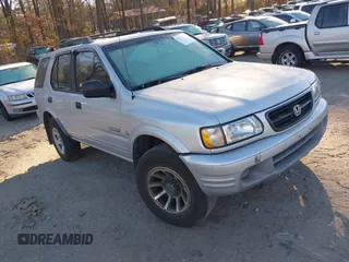 2000 Honda Passport LX with VIN 4S6CK58W4Y4415990, listed as a IAAI auction lot 41177782 with 242,583 mi miles. Bid and sale history available at carsss.com. Image 1.