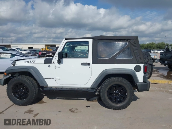 2015 Jeep Wrangler Willys Wheeler with VIN 1C4AJWAG0FL562536, listed as a IAAI auction lot 42384747 with 103,507 mi miles and . Bid and sale history available at DreamBid. Image 14.