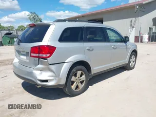 2012 Dodge Journey SXT z VIN 3C4PDCBGXCT390031, wystawiony jako IAAI lot #42281143 z przebiegiem 130 213 mil mil oraz . Historia ofert i sprzedaży dostępna na DreamBid. Obrazek 4.