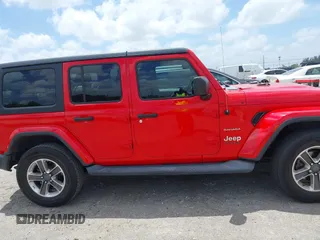 2019 Jeep Wrangler Unlimited Sahara with VIN 1C4HJXEG4KW573157, listed as a IAAI auction lot 42118373 with 105,890 mi miles and . Bid and sale history available at DreamBid. Image 13.