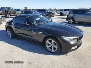 2015 BMW Z4 sDrive28i with VIN WBALL5C54FP557726, listed as a Copart auction lot 87249074 with 64,856 mi miles and Salvage Title. Bid and sale history available at carsss.com. Image 4.