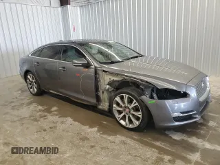 2019 Jaguar XJ Portfolio with VIN SAJWA2G71K8W19797, listed as a Copart auction lot 54133195 with 57,446 mi miles and Salvage Title. Bid and sale history available at DreamBid. Image 4.