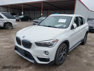 2019 BMW X1 xDrive28i with VIN WBXHT3C51K5L90392, listed as a IAAI auction lot 41571403 with 96,732 mi miles. Bid and sale history available at carsss.com. Image 17.