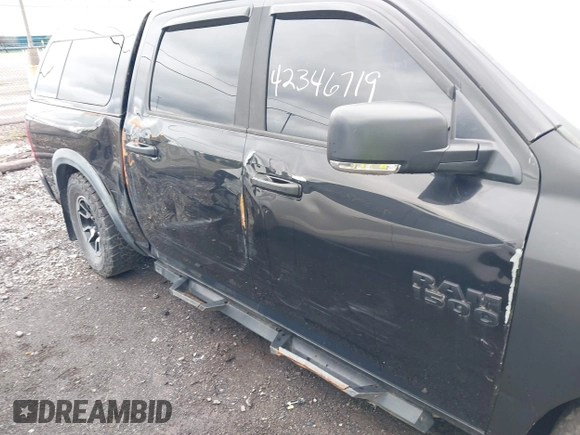 2016 Ram 1500 Rebel z VIN 1C6RR7YT0GS100285, wystawiony jako IAAI lot #42346719 z przebiegiem 103 309 mil mil oraz . Historia ofert i sprzedaży dostępna na DreamBid. Obrazek 6.