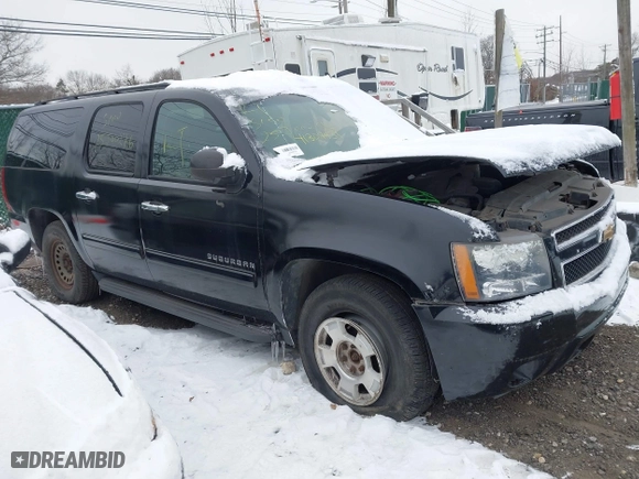 2010 Chevrolet Suburban LS with VIN 1GNUKHE37AR203811, listed as a IAAI auction lot 41304431 with 999,999 mi miles. Bid and sale history available at carsss.com. Image 1.