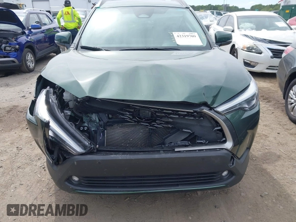 2023 Toyota Corolla Cross XLE with VIN 7MUEAAAG9PV053569, listed as a IAAI auction lot 42319709 with 71,105 mi miles and . Bid and sale history available at DreamBid. Image 11.
