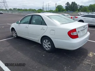 2004 Toyota Camry LE with VIN 4T1BE32K64U277496, listed as a IAAI auction lot 42130199 with 250,972 mi miles. Bid and sale history available at carsss.com. Image 3.