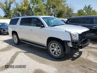 2015 GMC Yukon XL SLE with VIN 1GKS2GKC4FR678777, listed as a Copart auction lot 68642194 with 151,909 mi miles and Salvage Title. Bid and sale history available at carsss.com. Image 4.