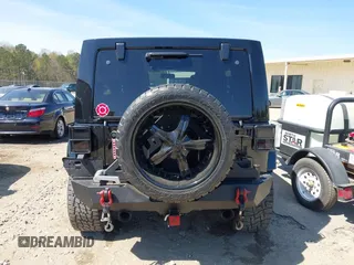 2014 Jeep Wrangler Unlimited Sahara with VIN 1C4BJWEG1EL258242, listed as a IAAI auction lot 41894966 with 90,234 mi miles. Bid and sale history available at carsss.com. Image 16.