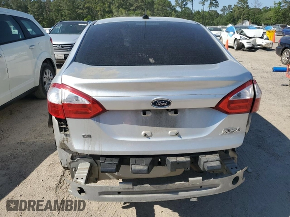 2019 Ford Fiesta SE z VIN 3FADP4BJXKM123806, wystawiony jako Copart lot #53184825 z przebiegiem 141 759 mil mil oraz Szkoda całkowita • Salvage title. Historia ofert i sprzedaży dostępna na DreamBid. Obrazek 6.