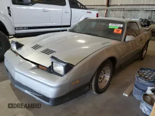 1988 Pontiac Firebird Trans Am с VIN 1G2FW21E5JL215215, выставлен на аукционе Copart как лот 76348314 с пробегом 289 030 миль миль и Чистый • Clean title. История ставок и продаж доступна на DreamBid. Изображение 1.