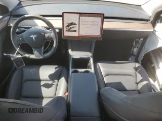2024 Tesla Model Y Long Range with VIN 7SAYGAEE2RF103110, listed as a Copart auction lot 59422975 with 13,572 mi miles and Salvage title. Bid and sale history available at DreamBid. Image 8.