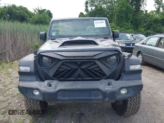 2020 Jeep Wrangler Unlimited Sport S with VIN 1C4HJXDN7LW113735, listed as a IAAI auction lot 42639884 with 48,736 mi miles and . Bid and sale history available at DreamBid. Image 12.
