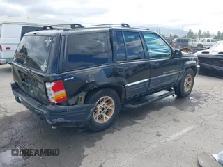 1996 Jeep Grand Cherokee Limited z VIN 1J4GZ78Y3TC191000, wystawiony jako IAAI lot #42259621 z przebiegiem 212 690 mil mil oraz . Historia ofert i sprzedaży dostępna na DreamBid. Obrazek 4.