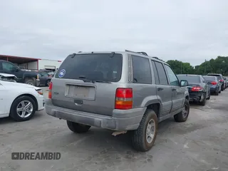 1998 Jeep Grand Cherokee Laredo with VIN 1J4FX58S6WC354101, listed as a IAAI auction lot 42158671 with 289,318 mi miles and . Bid and sale history available at DreamBid. Image 4.