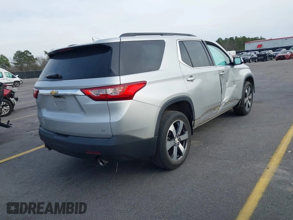 2019 Chevrolet Traverse LT with VIN 1GNERHKW6KJ140036, listed as a IAAI auction lot 41610615 with 98,685 mi miles and . Bid and sale history available at DreamBid. Image 4.