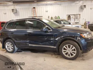 2014 Volkswagen Touareg Sport with VIN WVGEF9BP9ED008967, listed as a IAAI auction lot 41984409 with 193,859 mi miles and . Bid and sale history available at DreamBid. Image 13.