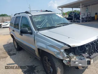 2004 Jeep Grand Cherokee Laredo z VIN 1J4GX48S74C165095, wystawiony jako IAAI lot #42306475 z przebiegiem 238 560 mil mil oraz . Historia ofert i sprzedaży dostępna na DreamBid. Obrazek 1.