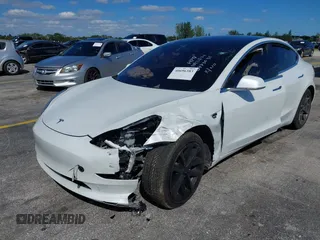 2020 Tesla Model 3 Standard Range Plus with VIN 5YJ3E1EA8LF783631, listed as a IAAI auction lot 40696383 with 78,889 mi miles. Bid and sale history available at carsss.com. Image 6.