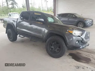 2019 Toyota Tacoma SR z VIN 3TMCZ5AN1KM257081, wystawiony jako IAAI lot #42211385 z przebiegiem 60 229 mil mil oraz . Historia ofert i sprzedaży dostępna na DreamBid. Obrazek 1.